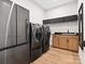 Spacious laundry room with side by side washer and dryer and additional storage space at 6020 Waldorf Ave, Monroe, NC 28110