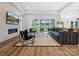 Spacious living room with fireplace, tv, and access to backyard and kitchen at 6020 Waldorf Ave, Monroe, NC 28110