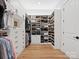A large closet with custom shelving provides ample space and organization options at 6020 Waldorf Ave, Monroe, NC 28110