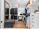This large walk-in closet offers ample storage, including custom shelving and workspace at 6020 Waldorf Ave, Monroe, NC 28110