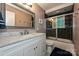 Updated bathroom featuring tile shower, stylish vanity and a large mirror at 617 Pinecrest St, Davidson, NC 28036