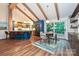 Dining area with modern table set, stylish kitchen bar, and sliding doors to the deck at 617 Pinecrest St, Davidson, NC 28036