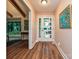 Entryway with hardwood floors, artwork, and a view into the living area and large windows at 617 Pinecrest St, Davidson, NC 28036
