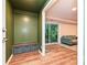 Hallway featuring built-in storage, bench and doorway to living area at 617 Pinecrest St, Davidson, NC 28036