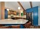Bright kitchen boasts a large island, modern appliances, blue cabinets, and hardwood floors at 617 Pinecrest St, Davidson, NC 28036
