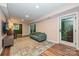 Basement living room featuring comfortable couch, hardwood floors, and lots of space at 617 Pinecrest St, Davidson, NC 28036