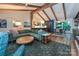 Open living space with hardwood floors, exposed beams, and seamless flow to the dining and kitchen areas at 617 Pinecrest St, Davidson, NC 28036