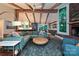 Spacious living area with beamed ceilings, fireplace, hardwood floors, and an open layout at 617 Pinecrest St, Davidson, NC 28036