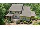 Beautiful aerial view of the house with a backyard featuring a brick patio and lush landscaping at 6422 Northern Red Oak Dr, Mint Hill, NC 28227