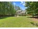Expansive backyard featuring a patio, deck, and plenty of space for outdoor activities at 6422 Northern Red Oak Dr, Mint Hill, NC 28227