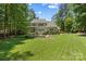 A manicured backyard with an outdoor living area perfect for entertaining at 6422 Northern Red Oak Dr, Mint Hill, NC 28227