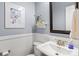 Charming powder room featuring stylish decor and a classic white pedestal sink at 6422 Northern Red Oak Dr, Mint Hill, NC 28227