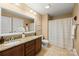 Well-lit bathroom featuring a double vanity, granite countertop, and tiled floor at 6422 Northern Red Oak Dr, Mint Hill, NC 28227