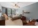 Comfortable bedroom with a ceiling fan, cozy decor, and soft natural light at 6422 Northern Red Oak Dr, Mint Hill, NC 28227