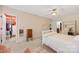 Bright bedroom featuring a ceiling fan, carpet, and a large, open closet space at 6422 Northern Red Oak Dr, Mint Hill, NC 28227