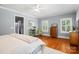 Spacious bedroom with hardwood floors, neutral paint, and ample natural light at 6422 Northern Red Oak Dr, Mint Hill, NC 28227