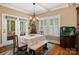 Inviting dining room with a neutral color palette, natural light, and a decorative fish tank at 6422 Northern Red Oak Dr, Mint Hill, NC 28227
