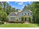 Charming two-story home featuring manicured landscaping, neutral siding, and a welcoming front porch at 6422 Northern Red Oak Dr, Mint Hill, NC 28227