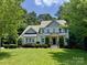 Charming two-story home with well-manicured lawn and lush landscaping at 6422 Northern Red Oak Dr, Mint Hill, NC 28227