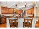Stylish kitchen with granite countertops, stainless steel appliances, and an open layout with a breakfast bar at 6422 Northern Red Oak Dr, Mint Hill, NC 28227