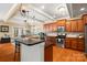 Modern kitchen featuring a large island, dark countertops, pendant lights, and stainless steel appliances at 6422 Northern Red Oak Dr, Mint Hill, NC 28227
