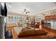 Open concept living room with hardwood floors, fireplace, and seamless flow to dining and kitchen areas at 6422 Northern Red Oak Dr, Mint Hill, NC 28227