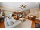 Spacious living room featuring a fireplace, hardwood floors, and seamless flow to the kitchen and dining at 6422 Northern Red Oak Dr, Mint Hill, NC 28227