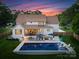 Beautiful backyard with a large pool, patio, lounge chairs and an outdoor dining area at 6505 Folger Dr, Charlotte, NC 28270