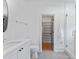 Bright bathroom featuring a walk-in closet, granite counters, and modern fixtures, creating a spa-like retreat at 6505 Folger Dr, Charlotte, NC 28270