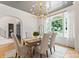 This dining room features a decorative light fixture and a view of the neighborhood at 6505 Folger Dr, Charlotte, NC 28270