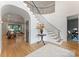 Grand foyer with a curved staircase and hardwood floors at 6505 Folger Dr, Charlotte, NC 28270