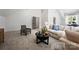 Spacious living room with a comfortable sofa, stylish chair, and large windows for ample natural light at 6505 Folger Dr, Charlotte, NC 28270