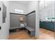This mudroom has a bench, coat hooks, and built in storage at 6505 Folger Dr, Charlotte, NC 28270