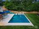 Luxurious pool surrounded by a spacious patio with comfortable seating, perfect for relaxation and entertainment at 6505 Folger Dr, Charlotte, NC 28270