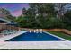 Spacious pool area with lounge chairs and umbrellas for relaxing poolside at 6505 Folger Dr, Charlotte, NC 28270