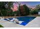 Beautiful swimming pool with in-pool lounge chairs at 6505 Folger Dr, Charlotte, NC 28270