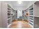 This walk-in closet features built-in shelves and racks at 6505 Folger Dr, Charlotte, NC 28270