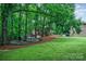 Picturesque backyard featuring a fire pit with an outdoor seating area at 676 Cottingham Ne Pl, Concord, NC 28025