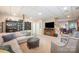 View of the finished basement with built-in shelving, a fireplace, and cozy seating at 676 Cottingham Ne Pl, Concord, NC 28025