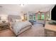 Bright bedroom with neutral tones, a large window, and comfortable furnishings at 676 Cottingham Ne Pl, Concord, NC 28025