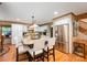 Spacious kitchen with granite counters, white cabinets, stainless steel appliances, and hardwood flooring at 676 Cottingham Ne Pl, Concord, NC 28025
