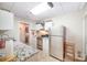 A kitchenette in the basement features stainless steel appliances and granite countertops at 676 Cottingham Ne Pl, Concord, NC 28025