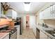 Basement kitchenette with updated appliances, light cabinetry and granite countertops at 676 Cottingham Ne Pl, Concord, NC 28025
