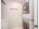 Second-floor laundry space with front-loading washer and dryer at 676 Cottingham Ne Pl, Concord, NC 28025