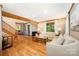 Spacious living room featuring hardwood floors, exposed beams, and a comfortable seating area at 676 Cottingham Ne Pl, Concord, NC 28025