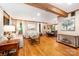 Open-concept living room with hardwood floors, comfortable seating, and easy access to the kitchen at 676 Cottingham Ne Pl, Concord, NC 28025