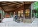 Welcoming porch with comfortable seating, showcasing the home's rustic charm at 676 Cottingham Ne Pl, Concord, NC 28025