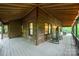 Inviting covered porch featuring wood accents and comfortable rocking chairs at 676 Cottingham Ne Pl, Concord, NC 28025