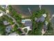 Aerial view of estate featuring pool and private dock on a lake in a well-maintained neighborhood at 8170 Bay Pointe Dr, Denver, NC 28037
