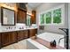 Bathroom with double vanities and a soaking tub at 8170 Bay Pointe Dr, Denver, NC 28037